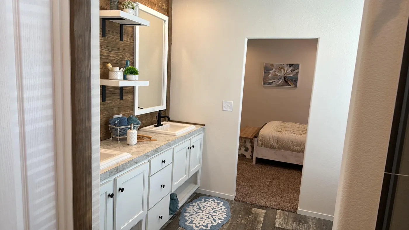 Dual porcelain sink vanity in the primary bathroom.