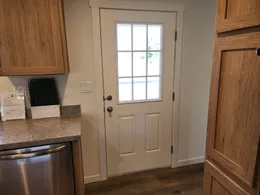 Exterior door to back of home off kitchen.