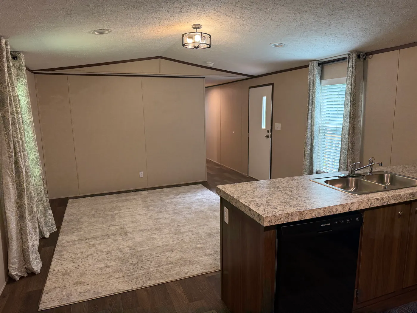 Kitchen looking into living room